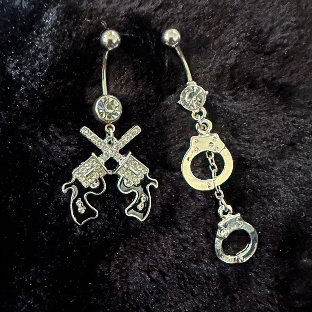 Brand new dangle belly button jewelry! Hand cuff and guns
